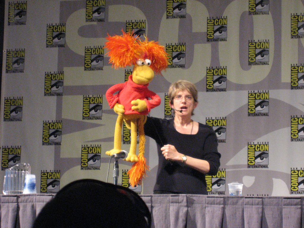 Karen Prell posing with Red Fraggle, one of the most recognizable original Fraggle Rock cast and puppeteer pairings.